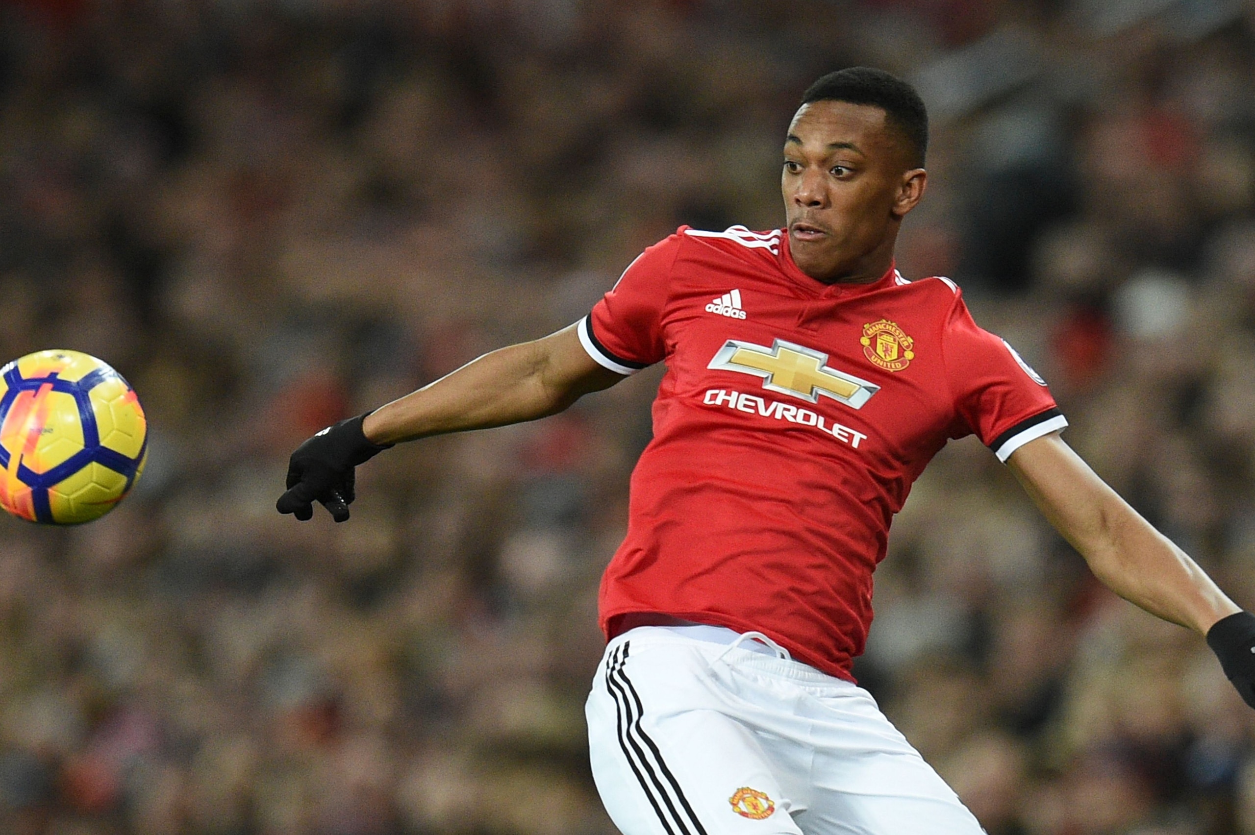 Manchester United's French striker Anthony Martial controls the ball during the English Premier League football match between Manchester United and Newcastle at Old Trafford in Manchester, north west England, on November 18, 2017. / AFP PHOTO / Oli SCARFF / RESTRICTED TO EDITORIAL USE. No use with unauthorized audio, video, data, fixture lists, club/league logos or 'live' services. Online in-match use limited to 75 images, no video emulation. No use in betting, games or single club/league/player publications.  /         (Photo credit should read OLI SCARFF/AFP/Getty Images)