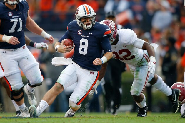 AUBURN, AL - NOVEMBER 25:  Jarrett Stidham #8 of the Auburn Tigers rushes the ball during the second quarter against the Alabama Crimson Tide at Jordan Hare Stadium on November 25, 2017 in Auburn, Alabama.  (Photo by Kevin C. Cox/Getty Images)