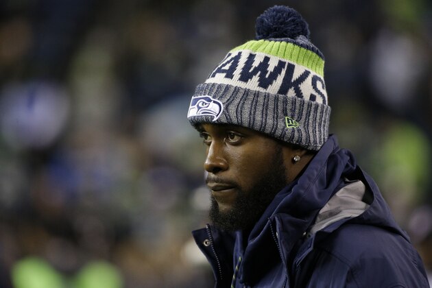 Injured Seattle Seahawks strong safety Kam Chancellor stands on the field before an NFL football game against the Atlanta Falcons, Monday, Nov. 20, 2017, in Seattle. (AP Photo/Ted S. Warren)