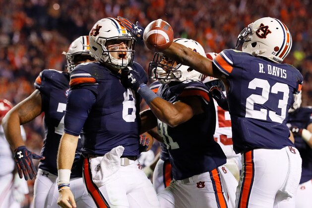 AUBURN, AL - NOVEMBER 25:  Jarrett Stidham #8 of the Auburn Tigers celebrates with teammates after rushing for a touchdown against the Alabama Crimson Tide at Jordan Hare Stadium on November 25, 2017 in Auburn, Alabama.  (Photo by Kevin C. Cox/Getty Images)