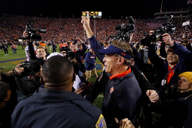 AUBURN, AL - NOVEMBER 25:  Head coach Gus Malzahn of the Auburn Tigers  celebrates after the victory over the Alabama Crimson Tide at Jordan Hare Stadium on November 25, 2017 in Auburn, Alabama.  (Photo by Kevin C. Cox/Getty Images)