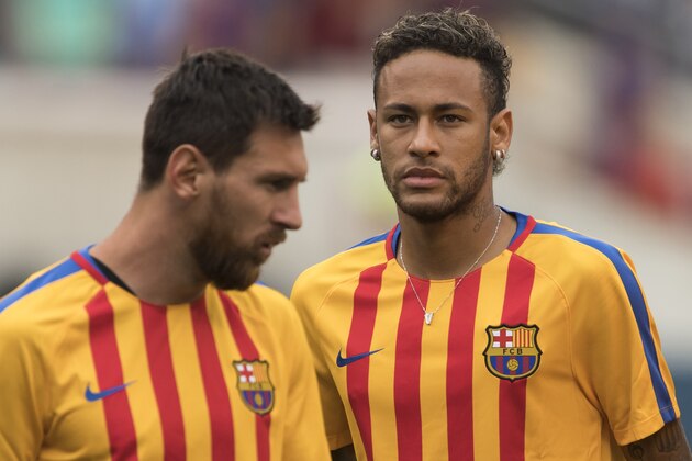 (FILES) This file photo taken on July 22, 2017 shows Neymar (R) and Lionel Messi (L) of FC Barcelona warming up before the International Champions Cup (ICC)  match between Juventus FC and FC Barcelona at the Met Life Stadium in East Rutherford, New Jersey.
One argument backing Neymar's decision to leave Barca on top of reportedly tripling his wages is to move out of Messi's shadow and compete to become the first Ballon d'Or winner outside of Messi and Ronaldo for a decade. / AFP PHOTO / DON EMMERT        (Photo credit should read DON EMMERT/AFP/Getty Images)