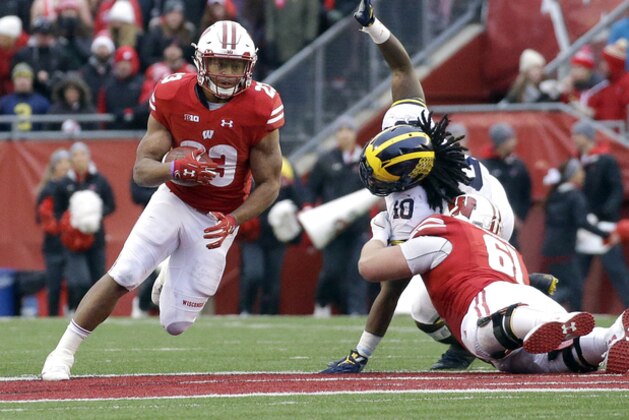 Wisconsin's Jonathan Taylor runs during an NCAA college football game against Michigan Saturday, Nov. 18, 2017, in Madison, Wis. (AP Photo/Aaron Gash)