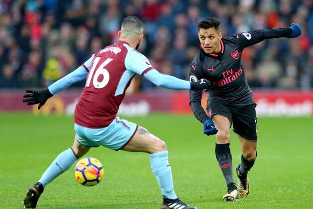 BURNLEY, ENGLAND - NOVEMBER 26:  Alexis Sanchez of Arsenal and Steven Defour of Burnley in action during the Premier League match between Burnley and Arsenal at Turf Moor on November 26, 2017 in Burnley, England.  (Photo by Jan Kruger/Getty Images)