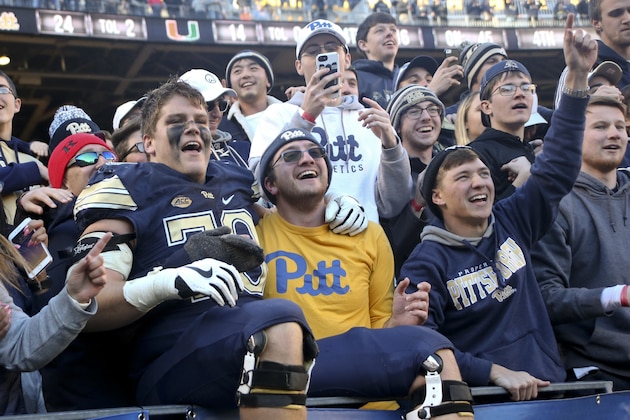 Pittsburgh offensive lineman Brian O'Neill (70) celebrates with fans in the student section after defeating Miami in an NCAA college football game, Friday, Nov. 24, 2017, in Pittsburgh. Pittsburgh upset number 2 ranked Miami, 24-14. (AP Photo/Keith Srakocic)