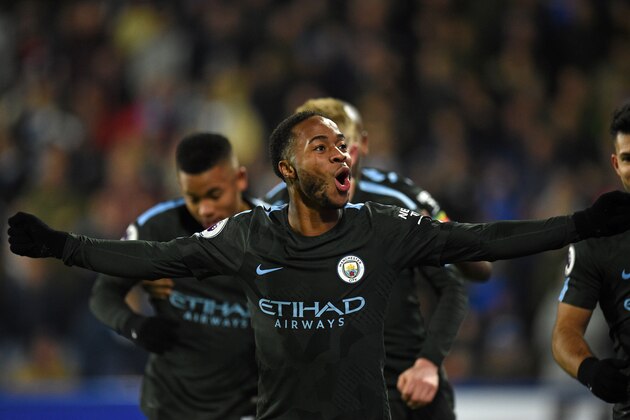Manchester City's English midfielder Raheem Sterling celebrates after scoring their second goal during the English Premier League football match between Huddersfield Town and Manchester City at the John Smith's stadium in Huddersfield, northern England on November 26, 2017. / AFP PHOTO / Oli SCARFF / RESTRICTED TO EDITORIAL USE. No use with unauthorized audio, video, data, fixture lists, club/league logos or 'live' services. Online in-match use limited to 75 images, no video emulation. No use in betting, games or single club/league/player publications.  /         (Photo credit should read OLI SCARFF/AFP/Getty Images)