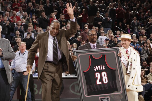 PORTLAND, OR - APRIL 1:  Former Portland Trail Blazers broadcaster Steve Jones (center) is honored for his 26 year career with the team prior to the game against he Minnesota Timberwolves on April 1, 2012 at the Rose Garden Arena in Portland, Oregon. NOTE TO USER: User expressly acknowledges and agrees that, by downloading and or using this photograph, User is consenting to the terms and conditions of the Getty Images License Agreement. Mandatory Copyright Notice: Copyright 2012 NBAE (Photo by Cameron Browne/NBAE via Getty Images)