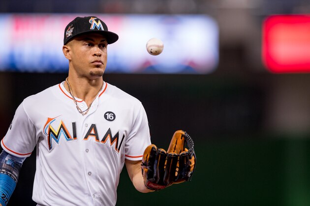 MIAMI, FL - SEPTEMBER 29: Giancarlo Stanton #27 of the Miami Marlins tosses a ball in the air during the game against the Atlanta Braves at Marlins Park on September 29, 2017 in Miami, Florida. (Photo by Rob Foldy/Miami Marlins via Getty Images)