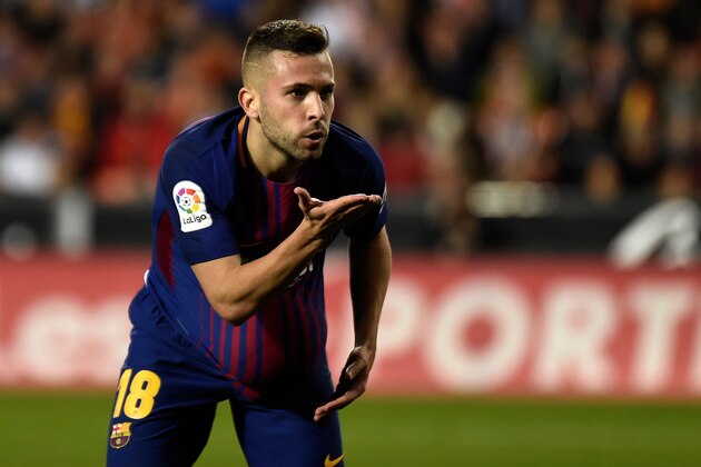 Barcelona's defender Jordi Alba celebrates after scoring during the Spanish league football match Valencia CF and FC Barcelona at Mestalla stadium in Valencia on November 26, 2017. / AFP PHOTO / JOSE JORDAN        (Photo credit should read JOSE JORDAN/AFP/Getty Images)