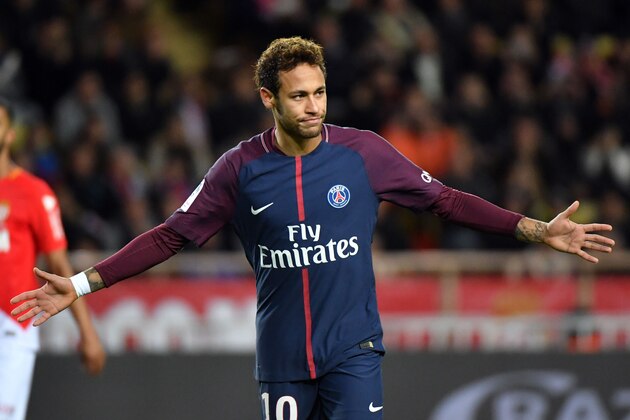 Paris Saint-Germain's Brazilian forward Neymar celebrates after scoring a penalty kick during the French L1 football match between Monaco and Paris Saint-Germain (PSG) at the Louis II stadium, in Monaco, on November 26, 2017. / AFP PHOTO / Yann COATSALIOU        (Photo credit should read YANN COATSALIOU/AFP/Getty Images)