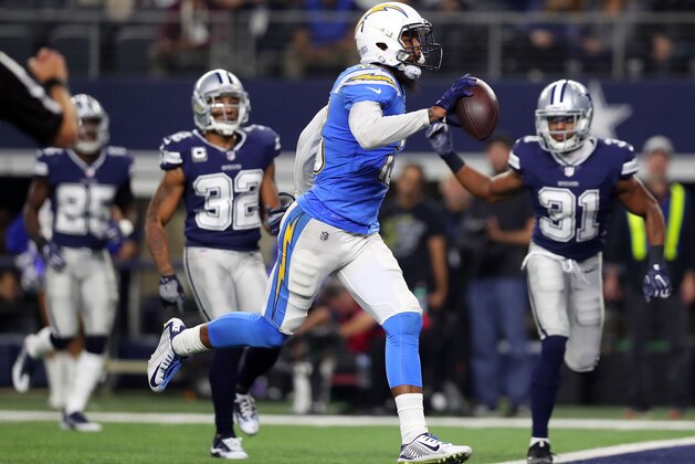 ARLINGTON, TX - NOVEMBER 23:  Keenan Allen #13 of the Los Angeles Chargers runs the ball in for a fourth quarter touchdown against the Dallas Cowboys at AT&T Stadium on November 23, 2017 in Arlington, Texas.  (Photo by Tom Pennington/Getty Images)