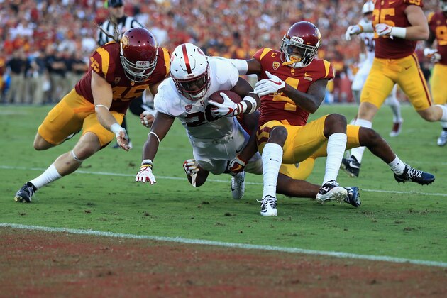 LOS ANGELES, CA - SEPTEMBER 09:  Bryce Love #20 of the Stanford Cardinal is tackled near the goal line during the first half against the USC Trojans at Los Angeles Memorial Coliseum on September 9, 2017 in Los Angeles, California.  (Photo by Sean M. Haffey/Getty Images)