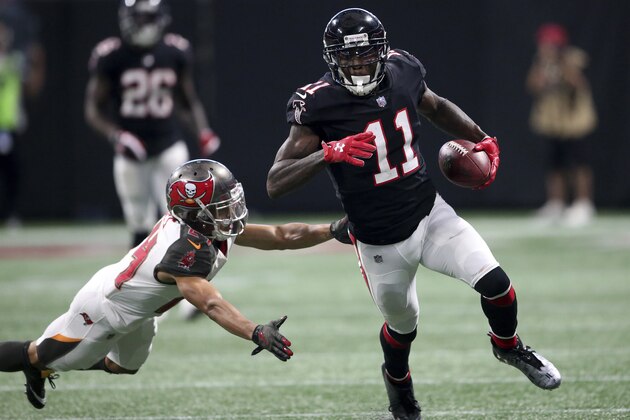 Atlanta Falcons wide receiver Julio Jones (11) runs against Tampa Bay Buccaneers cornerback Brent Grimes (24) during the second half of an NFL football game, Sunday, Nov. 26, 2017, in Atlanta. (AP Photo/John Bazemore)