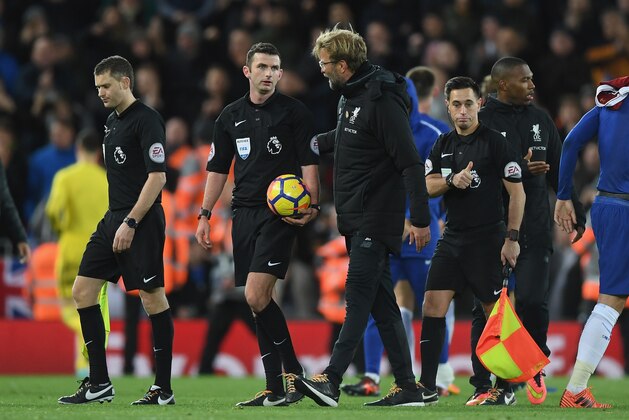 LIVERPOOL, ENGLAND - NOVEMBER 25:  Jurgen Klopp, Manager of Liverpool confronts referee Michael Oliver after the Premier League match between Liverpool and Chelsea at Anfield on November 25, 2017 in Liverpool, England.  (Photo by Shaun Botterill/Getty Images)