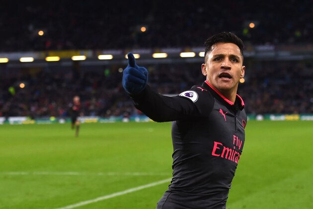 Arsenal's Chilean striker Alexis Sanchez celebrates scoring a penalty during the English Premier League football match between Burnley and Arsenal at Turf Moor in Burnley, north west England on November 26, 2017. / AFP PHOTO / PAUL ELLIS / RESTRICTED TO EDITORIAL USE. No use with unauthorized audio, video, data, fixture lists, club/league logos or 'live' services. Online in-match use limited to 75 images, no video emulation. No use in betting, games or single club/league/player publications.  /         (Photo credit should read PAUL ELLIS/AFP/Getty Images)