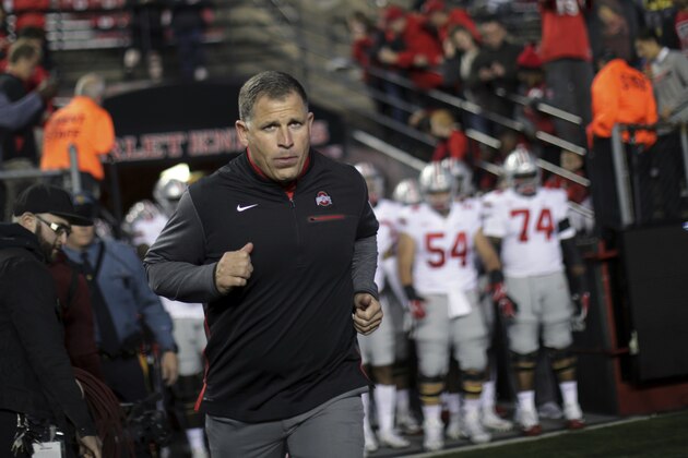 Former Rutgers football head coach, now Ohio State associate head coach/defensive coordinator, Greg Schiano runs onto the field before an NCAA college football game against Rutgers, Saturday, Sept. 30, 2017, in Piscataway, N.J. (AP Photo/Mel Evans)