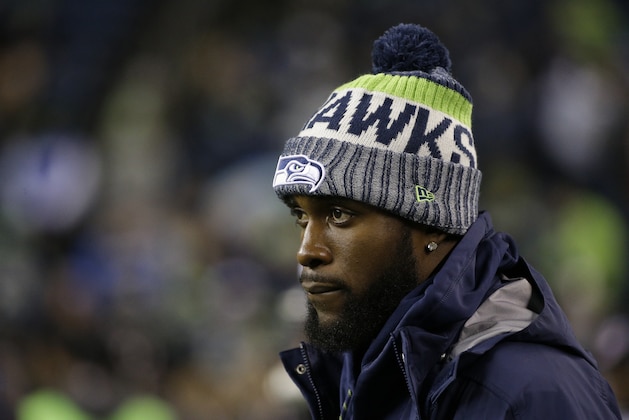 Injured Seattle Seahawks strong safety Kam Chancellor stands on the field before an NFL football game against the Atlanta Falcons, Monday, Nov. 20, 2017, in Seattle. (AP Photo/Ted S. Warren)