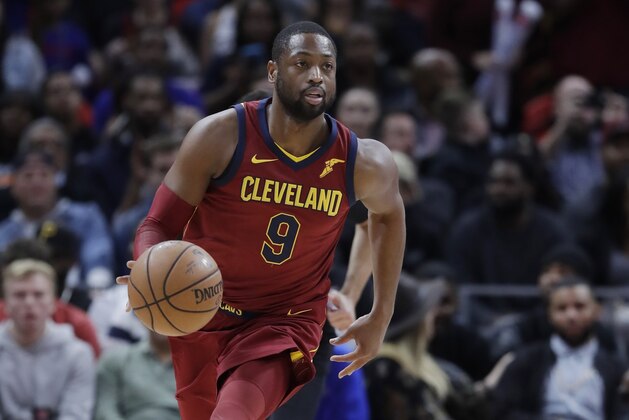 Cleveland Cavaliers guard Dwyane Wade brings the ball up court during the second half of an NBA basketball game, Monday, Nov. 20, 2017, in Detroit. (AP Photo/Carlos Osorio)