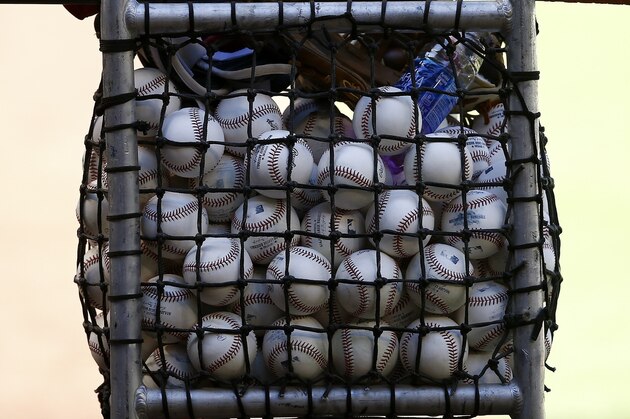 Practice baseballs await batting practice at Chase Field as the team gets ready for a National League wild card playoff baseball game Monday, Oct. 2, 2017, in Phoenix. The Diamondbacks face the Colorado Rockies on Wednesday. (AP Photo/Ross D. Franklin)
