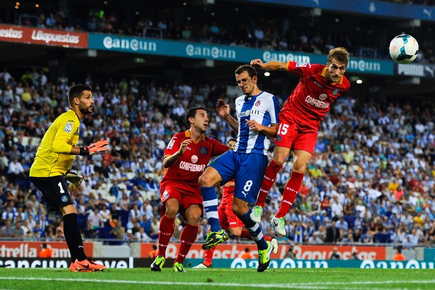 BARCELONA, SPAIN - SEPTEMBER 29: Rafael Lopez (R) of Getafe CF clear the ball under pressure from Christian Stuani of RCD Espanyol during the La Liga match between RCD Espanyol and Getafe CF at Cornella-El Prat Stadium on September 29, 2013 in Barcelona, Spain. (Photo by David Ramos/Getty Images) BARCELONA, SPAIN - SEPTEMBER 29: Rafael Lopez (R) of Getafe CF clear the ball under pressure from Christian Stuani of RCD Espanyol during the La Liga match between RCD Espanyol and Getafe CF at Cornella-El Prat Stadium on September 29, 2013 in Barcelona, Spain. (Photo by David Ramos/Getty Images)