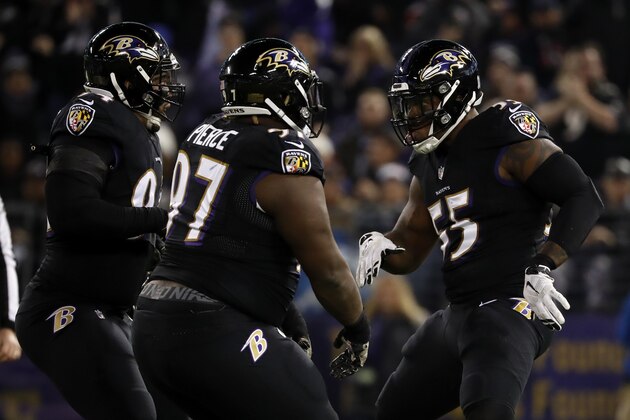 BALTIMORE, MD - NOVEMBER 27: Outside Linebacker Terrell Suggs #55 and nose tackle Michael Pierce #97 of the Baltimore Ravens celebrate after a sack in the second quarter at M&T Bank Stadium on November 27, 2017 in Baltimore, Maryland. (Photo by Scott Taetsch/Getty Images)
