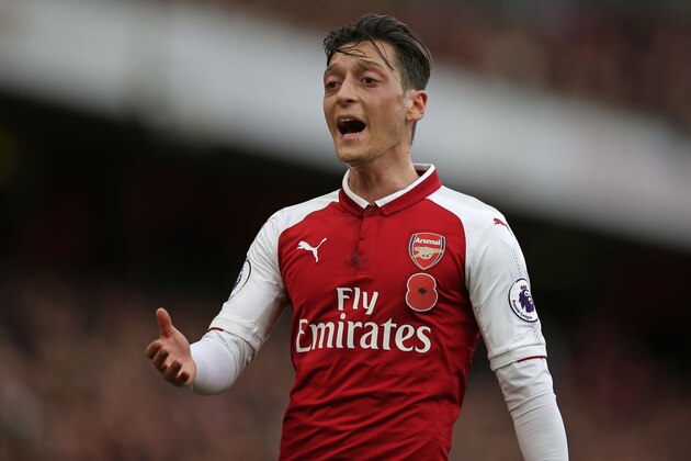 Arsenal's German midfielder Mesut Ozil gestures during the English Premier League football match between Arsenal and Swansea City at the Emirates Stadium in London on October 28, 2017.  / AFP PHOTO / Daniel LEAL-OLIVAS / RESTRICTED TO EDITORIAL USE. No use with unauthorized audio, video, data, fixture lists, club/league logos or 'live' services. Online in-match use limited to 75 images, no video emulation. No use in betting, games or single club/league/player publications.  /         (Photo credit should read DANIEL LEAL-OLIVAS/AFP/Getty Images)