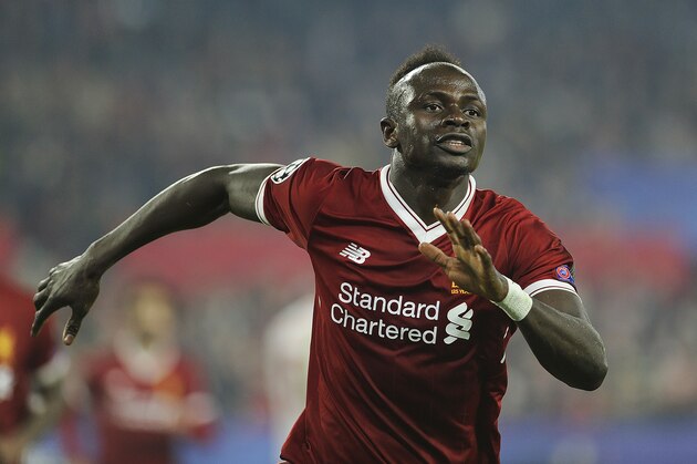 Liverpool's Senegalese midfielder Sadio Mane celebrates after scoring a goal on November 21, 2017 at the Ramon Sanchez Pizjuan stadium in Sevilla during the UEFA Champions League group E football match between Sevilla FC and Liverpool FC. / AFP PHOTO / CRISTINA QUICLER        (Photo credit should read CRISTINA QUICLER/AFP/Getty Images)