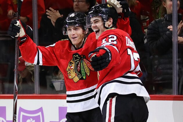 CHICAGO, IL - NOVEMBER 27:  Patrick Kane #88 (L) and Alex DeBrincat #12 of the Chicago Blackhawks
celebrate DeBrincat's thrid goal of the game in the second period against the Anaheim Ducks at the United Center on November 27, 2017 in Chicago, Illinois. (Photo by Jonathan Daniel/Getty Images)