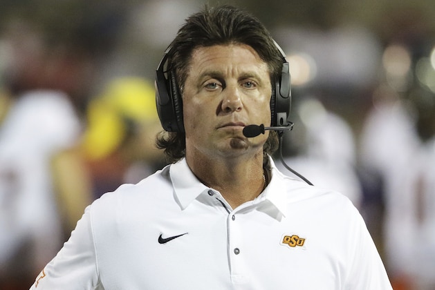 Oklahoma State Mike Gundy walks the sidelines during the second half of an NCAA college football game against South Alabama, Friday, Sept. 8, 2017, in Mobile, Ala. Oklahoma State won 44-7. (AP Photo/Dan Anderson)
