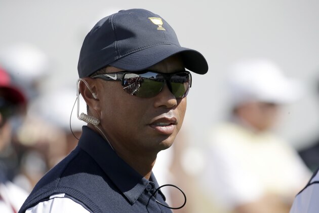 Tiger Woods looks on before the first round of the Presidents Cup at Liberty National Golf Club in Jersey City, N.J., Thursday, Sept. 28, 2017. (AP Photo/Julio Cortez)