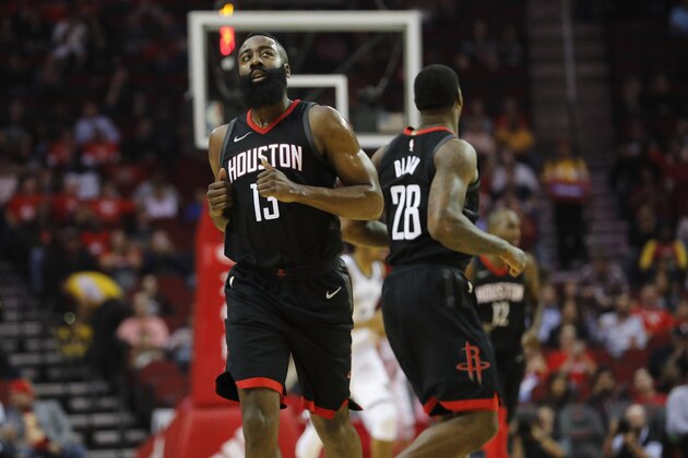 HOUSTON, TX - NOVEMBER 27:  James Harden #13 of the Houston Rockets looks at the scoreboard as he runs down the court after a three point shot in the first half against the Brooklyn Nets at Toyota Center on November 27, 2017 in Houston, Texas.  NOTE TO USER: User expressly acknowledges and agrees that, by downloading and or using this photograph, User is consenting to the terms and conditions of the Getty Images License Agreement.  (Photo by Tim Warner/Getty Images)