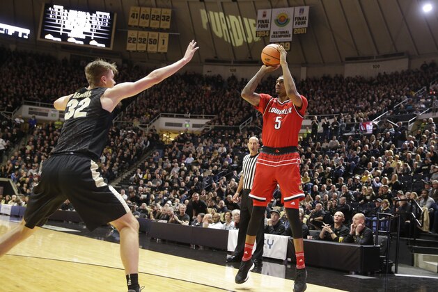 Louisville forward Malik Williams (5) shoots over Purdue forward Matt Haarms (32) in the first half of an NCAA college basketball game in West Lafayette, Ind., Tuesday, Nov. 28, 2017. (AP Photo/Michael Conroy)