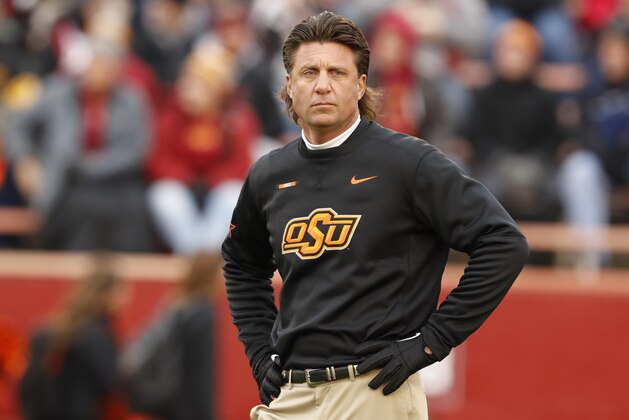 AMES, IA - NOVEMBER 11: Head coach Mike Gundy of the Oklahoma State Cowboys coaches during warm ups before game action against the Iowa State Cyclones at Jack Trice Stadium on November 11, 2017 in Ames, Iowa. The Oklahoma State Cowboys won 49-42 over the Iowa State Cyclones. (Photo by David K Purdy/Getty Images)