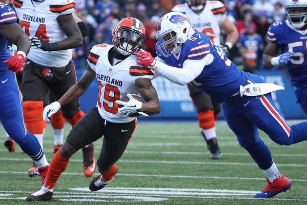 ORCHARD PARK, NY - DECEMBER 18: Corey Coleman #19 of the Cleveland Browns runs with the ball as he is tackled by Lorenzo Alexander #57 of the Buffalo Bills grabs his facemask during NFL game action at New Era Field on December 18, 2016 in Orchard Park, New York. (Photo by Tom Szczerbowski/Getty Images)