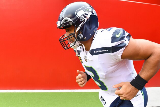 SANTA CLARA, CA - NOVEMBER 26:  Russell Wilson #3 of the Seattle Seahawks runs onto the field to warm up prior to the start of their NFL football game against the San Francisco 49ers at Levi's Stadium on November 26, 2017 in Santa Clara, California.  (Photo by Thearon W. Henderson/Getty Images)