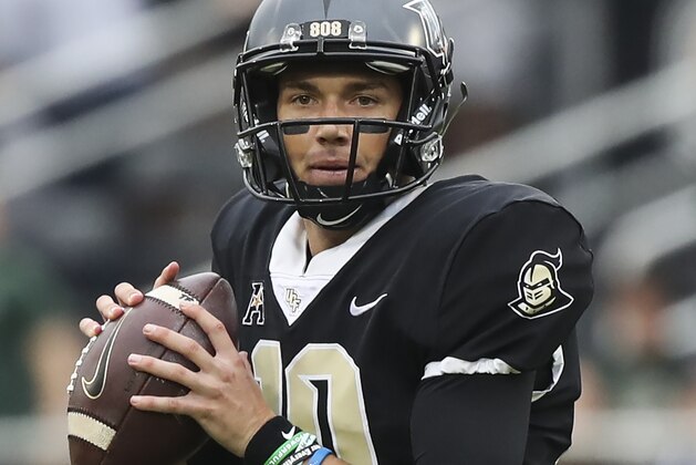 ORLANDO, FL - NOVEMBER 24: McKenzie Milton #10 of the UCF Knights looks to pass the ball in the first quarter against the South Florida Bulls at Spectrum Stadium on November 24, 2017 in Orlando, Florida. (Photo by Logan Bowles/Getty Images)