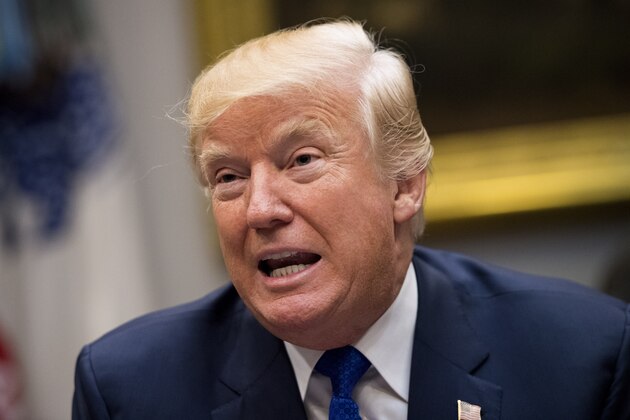 WASHINGTON, DC - NOVEMBER 28: (AFP OUT) U.S. President Donald Trump speaks to the media during a meeting with congressional leadership in the Roosevelt Room at the White House on November 28, 2017 in Washington, DC. Trump spoke on the recent intercontinental ballistic missile launch by North Korea. Democratic leaders Sen. Charles Schumer, D-NY, and Re. Nancy Pelosi, D-CA, skipped the meeting with President Trump. (Photo by Kevin Dietsch-Pool/Getty Images)