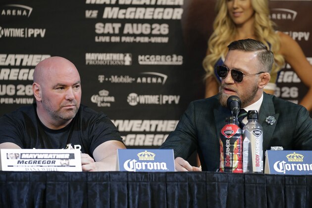 Conor McGregor, right, speaks during news conference Wednesday, Aug. 23, 2017, in Las Vegas. McGregor is scheduled to fight Floyd Mayweather Jr. in a boxing match Saturday in Las Vegas. Dana White is on the left. (AP Photo/John Locher)