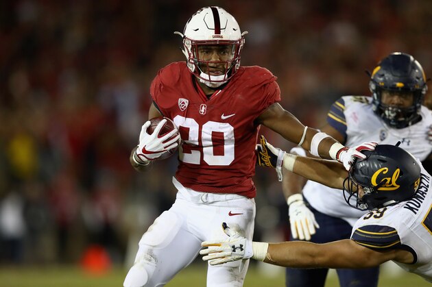 PALO ALTO, CA - NOVEMBER 18:  Bryce Love #20 of the Stanford Cardinal runs with the ball against the California Golden Bears at Stanford Stadium on November 18, 2017 in Palo Alto, California.  (Photo by Ezra Shaw/Getty Images)