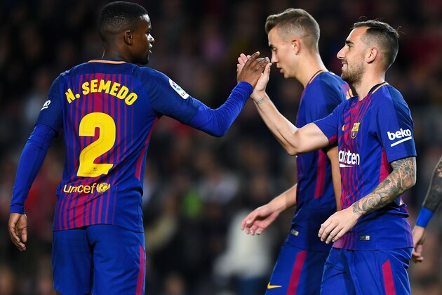 BARCELONA, SPAIN - NOVEMBER 29:  Paco Alcacer of FC Barcelona (R) celebrates with his team mate Nelson Semedo after scoring his team's first goal during the Copa del Rey round of 32 second leg match between FC Barcelona and Real Murcia on at Camp Nou on November 29, 2017 in Barcelona, Spain.  (Photo by David Ramos/Getty Images)