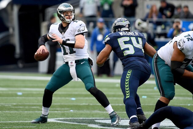 SEATTLE, WA - NOVEMBER 20:  Quarterback Carson Wentz #11 of the Philadelphia Eagles passes against the Seattle Seahawks at CenturyLink Field on November 20, 2016 in Seattle, Washington.  (Photo by Steve Dykes/Getty Images)
