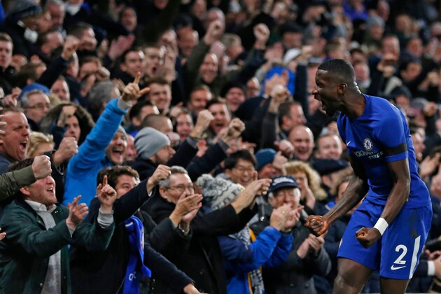 Chelsea's German defender Antonio Rudiger celebrates after scoring the opening goal of the English Premier League football match between Chelsea and Swansea City at Stamford Bridge in London on November 29, 2017. / AFP PHOTO / Ian KINGTON / RESTRICTED TO EDITORIAL USE. No use with unauthorized audio, video, data, fixture lists, club/league logos or 'live' services. Online in-match use limited to 75 images, no video emulation. No use in betting, games or single club/league/player publications.  /         (Photo credit should read IAN KINGTON/AFP/Getty Images)