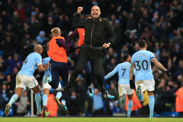 Manchester City's Spanish manager Pep Guardiola celebrates after Manchester City's English midfielder Raheem Sterling scores his team's second goal during the English Premier League football match between Manchester City and Southampton at the Etihad Stadium in Manchester, north west England, on November 29, 2017.
Manchester City won the match 2-1. / AFP PHOTO / Lindsey PARNABY / RESTRICTED TO EDITORIAL USE. No use with unauthorized audio, video, data, fixture lists, club/league logos or 'live' services. Online in-match use limited to 75 images, no video emulation. No use in betting, games or single club/league/player publications.  /         (Photo credit should read LINDSEY PARNABY/AFP/Getty Images)