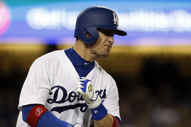 Los Angeles Dodgers' Yasmani Grandal reacts after hitting a three-run home run against the San Diego Padres during the fifth inning of a baseball game in Los Angeles, Tuesday, Sept. 26, 2017. (AP Photo/Alex Gallardo)