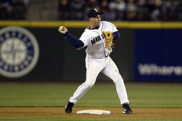 SEATTLE - APRIL 5:  Bret Boone  #29 of the Seattle Mariners throws to first during the game with the Minnesota Twins on April 5 2005 at Safeco Field in Seattle, Washington.  The Twins won 8-4.  (Photo by Otto Greule Jr/Getty Images)