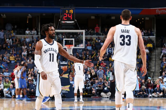 MEMPHIS, TN - OCTOBER 26:  Marc Gasol #33 and Mike Conley #11 of the Memphis Grizzlies high five during the game against the Dallas Mavericks on October 26, 2017 at FedExForum in Memphis, Tennessee. NOTE TO USER: User expressly acknowledges and agrees that, by downloading and or using this photograph, User is consenting to the terms and conditions of the Getty Images License Agreement. Mandatory Copyright Notice: Copyright 2017 NBAE (Photo by Joe Murphy/NBAE via Getty Images)