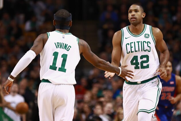 BOSTON, MA - NOVEMBER 27:  Al Horford #42 and Kyrie Irving #11 of the Boston Celtics low five during the game against the Detroit Pistons at TD Garden on November 27, 2017 in Boston, Massachusetts. NOTE TO USER: User expressly acknowledges and agrees that, by downloading and or using this photograph, User is consenting to the terms and conditions of the Getty Images License Agreement.  (Photo by Omar Rawlings/Getty Images)