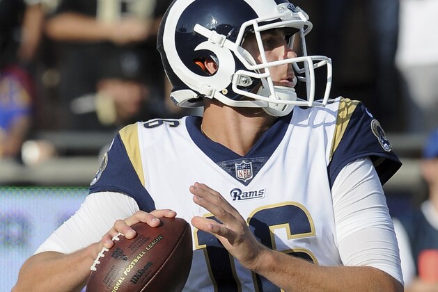 Los Angeles Rams quarterback Jared Goff (16) back to pass in the second quarter of a game against the New Orleans Saints played at the Los Angeles Memorial Coliseum in Los Angeles on Sunday, November 26, 2017. (AP Photo/John Cordes)