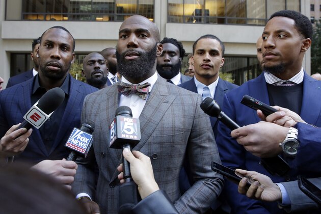In this Tuesday, Oct. 17, 2017, file photo, Former NFL football player Anquan Boldin, left, Philadelphia Eagles Malcolm Jenkins, center, and San Francisco 49ers Eric Reid, right, speak to the media outside the league's headquarters after meetings in New York. San Francisco 49ers linebacker Eric Reid says he left The Players Coalition because founder Malcolm Jenkins excluded Colin Kaepernick from meetings, and asked players if they would stop protesting the anthem if the NFL made a charitable donation to causes they support. (AP Photo/Richard Drew, File)