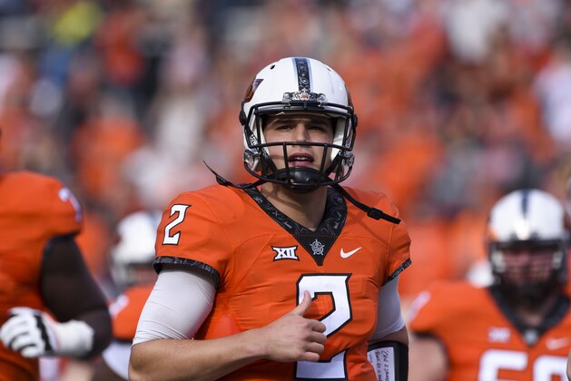 Oklahoma St quarterback Mason Rudolph looks to the sidelines during a NCAA college football game between Kansas and Oklahoma St in Stillwater, Okla., Saturday, Nov. 25, 2017.(AP Photo/Brody Schmidt)
